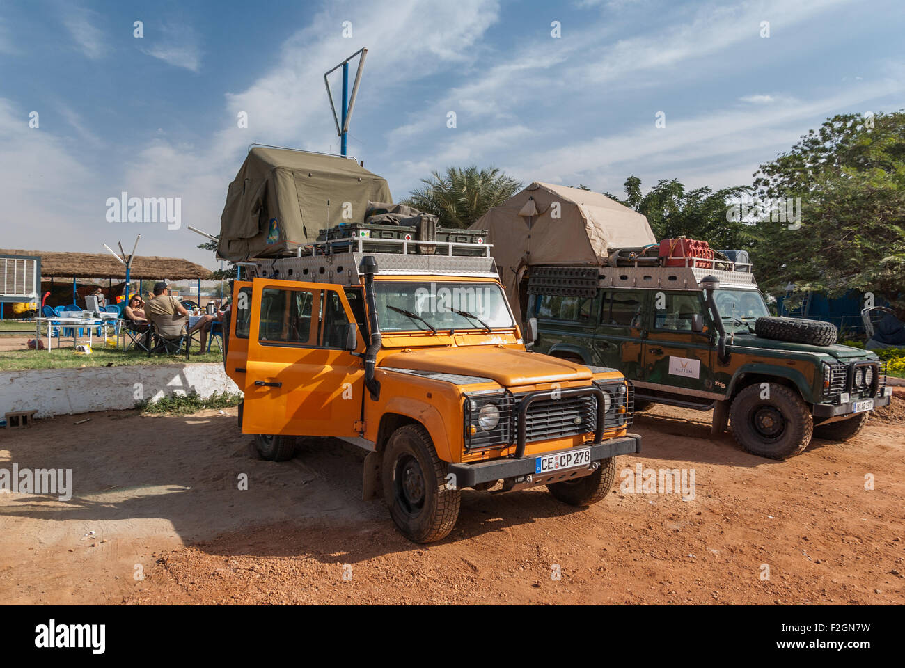 Two Land Rover Defenders with rooftop tents in Blue Nile Sailing Club, Khartoum, Sudan Stock Photo