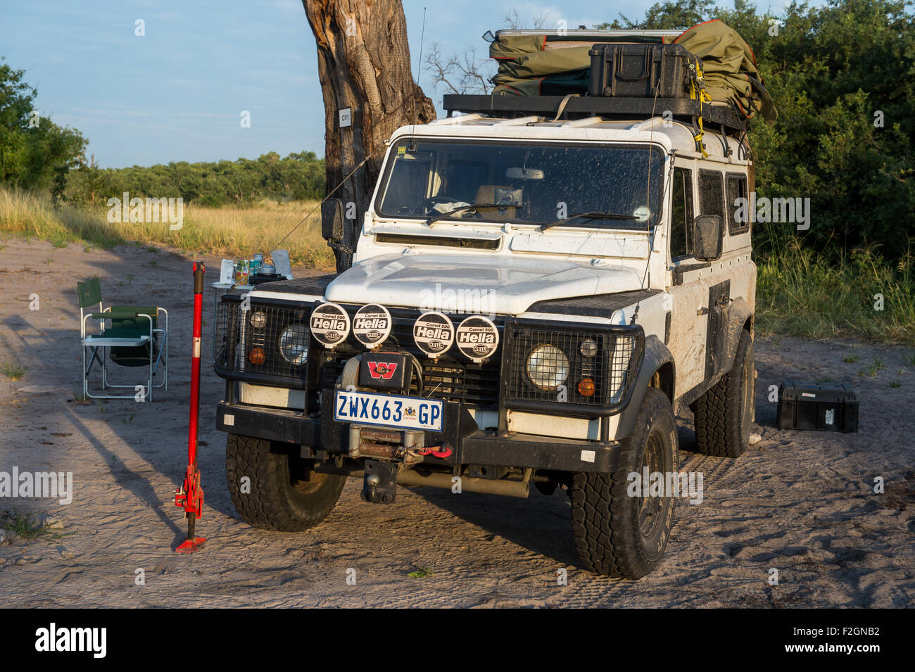 Land Rover parked on a dirt road with no one else around in Botswana, Africa Stock Photo