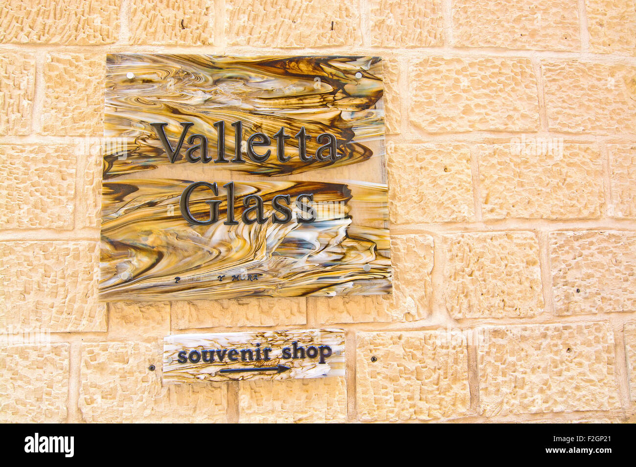 Valletta glass sign within old city walls Stock Photo