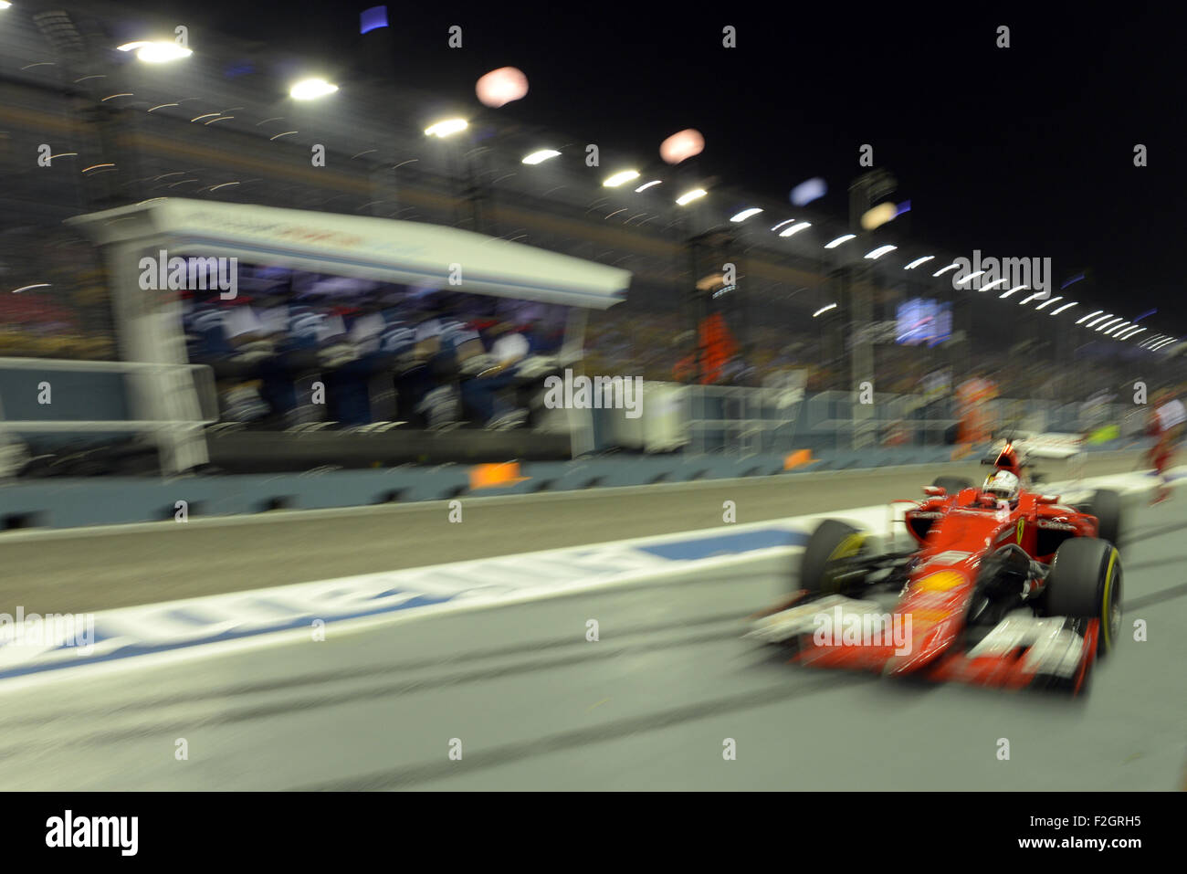 Singapore. 18th Sep, 2015. Team Ferrari driver Sebastian Vettel drives in the second practice during F1 Singapore Grand Prix Night Race in Singapore's Marina Bay Street Circuit, Sept. 18, 2015. © Then Chih Wey/Xinhua/Alamy Live News Stock Photo