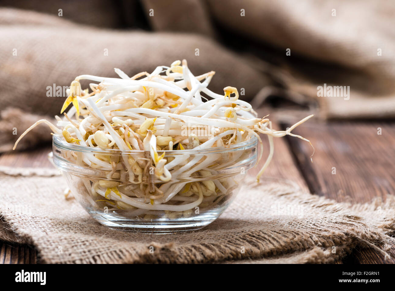 Mungbean Sprouts (close-up shot) on wooden background Stock Photo