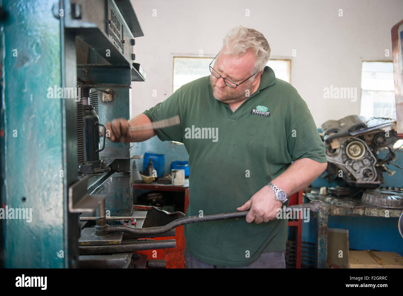 Auto Mechanic working in his shop in Africa Stock Photo