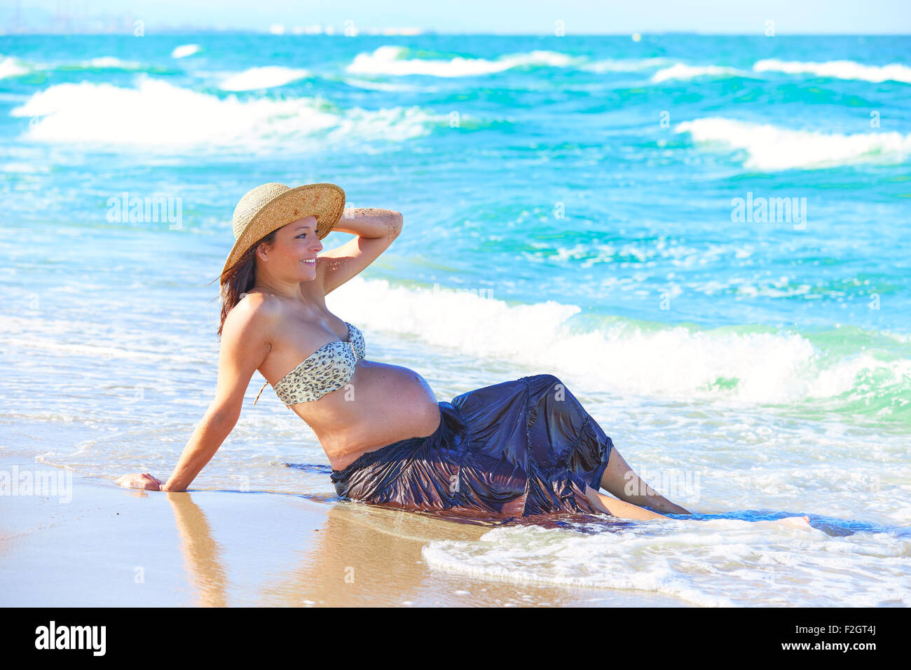 Pregnant Woman On The Beach Playing With Waves Stock Photo Alamy