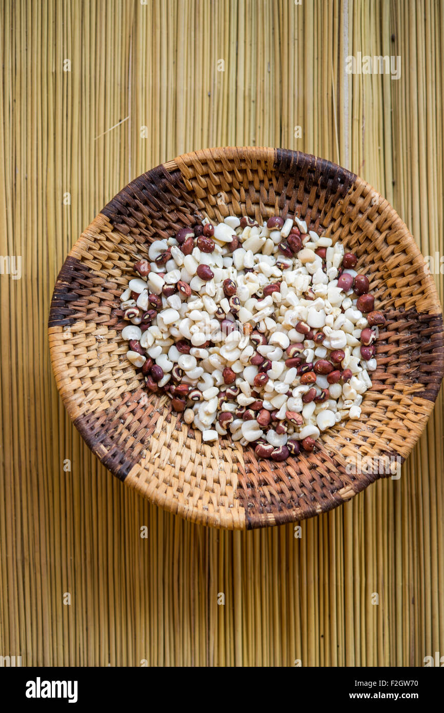 Dried corn and beans in a handwoven bowl in Botswana, Africa Stock Photo