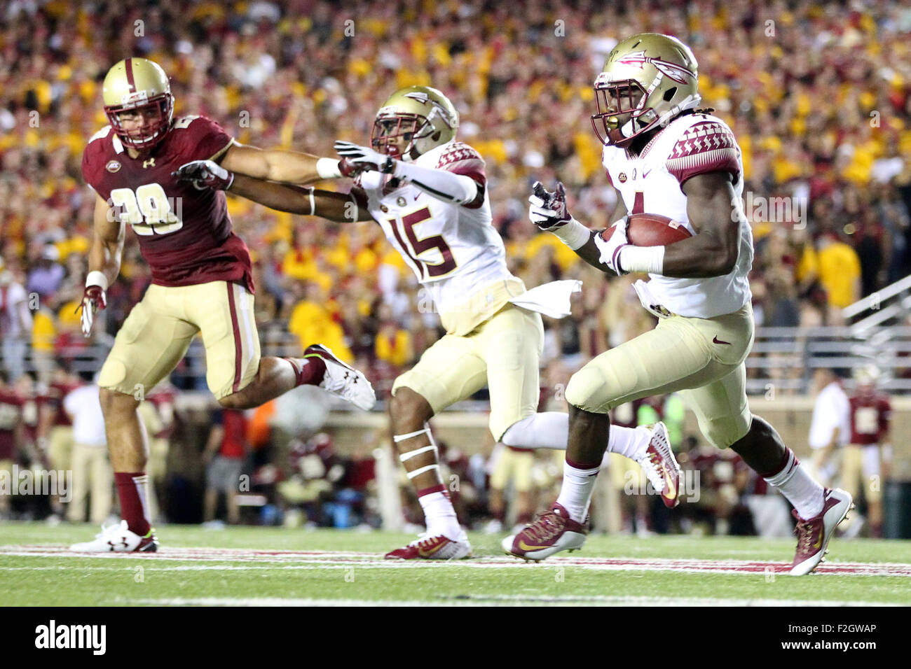 September 18, 2015; Chestnut Hill, MA, USA; Florida State Seminoles wide receiver Travis Rudolph (15) blocks Boston College Eagles linebacker Matt Milano (28) as Florida State Seminoles running back Dalvin Cook (4) runs with the ball during the second half of the NCAA football game between the Boston College Eagles and Florida State Seminoles at Alumni Stadium. Florida State defeated Boston College 14-0. Anthony Nesmith/Cal Sport Media Stock Photo