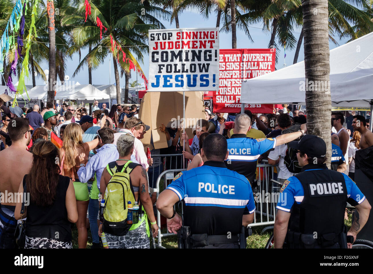 Miami Beach Florida,Lummus Park,evangelical Christian,religious street preacher,preaching,police,policemen,monitoring,FL150412010 Stock Photo