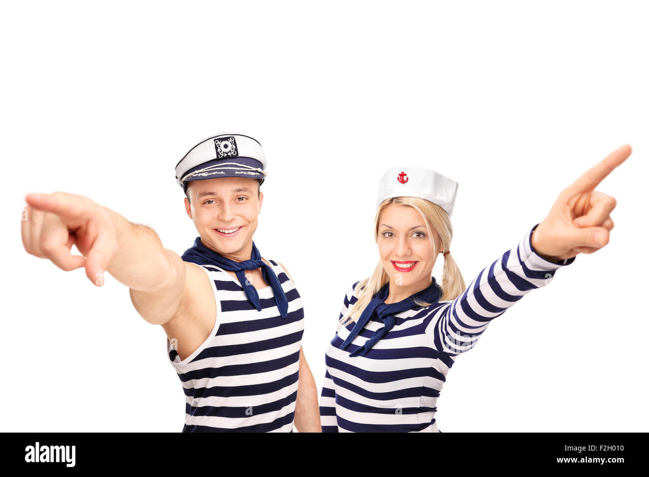 Male and female sailor pointing up with their fingers and looking at ...