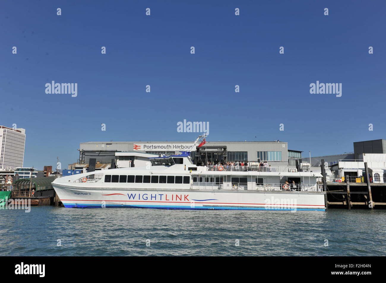 Portsmouth Hampshire UK - Portsmouth Harbour Railway Station and Wightlink cross Solent Isle of Wight ferry Stock Photo