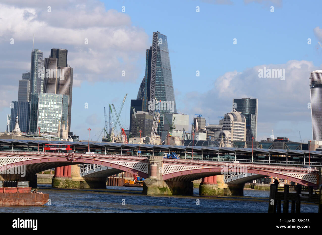 London, UK, 21/02/2014, The Cheese grater building behind Blackfriars Bridge. View of the Thames on a sunny day. Stock Photo