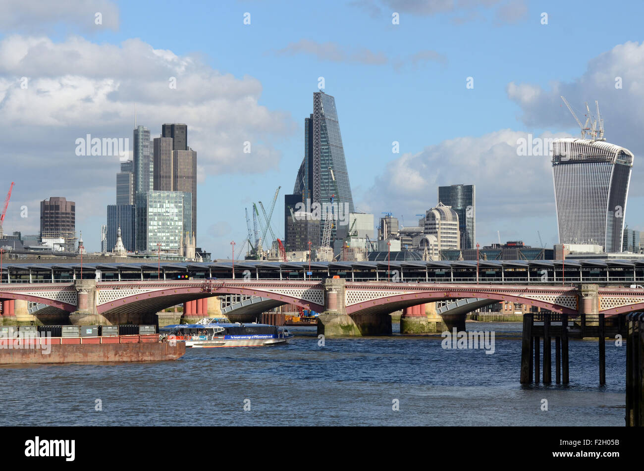 London, UK, 21/02/2014, The Cheese grater building behind Blackfriars Bridge. View of the Thames on a sunny day. Stock Photo
