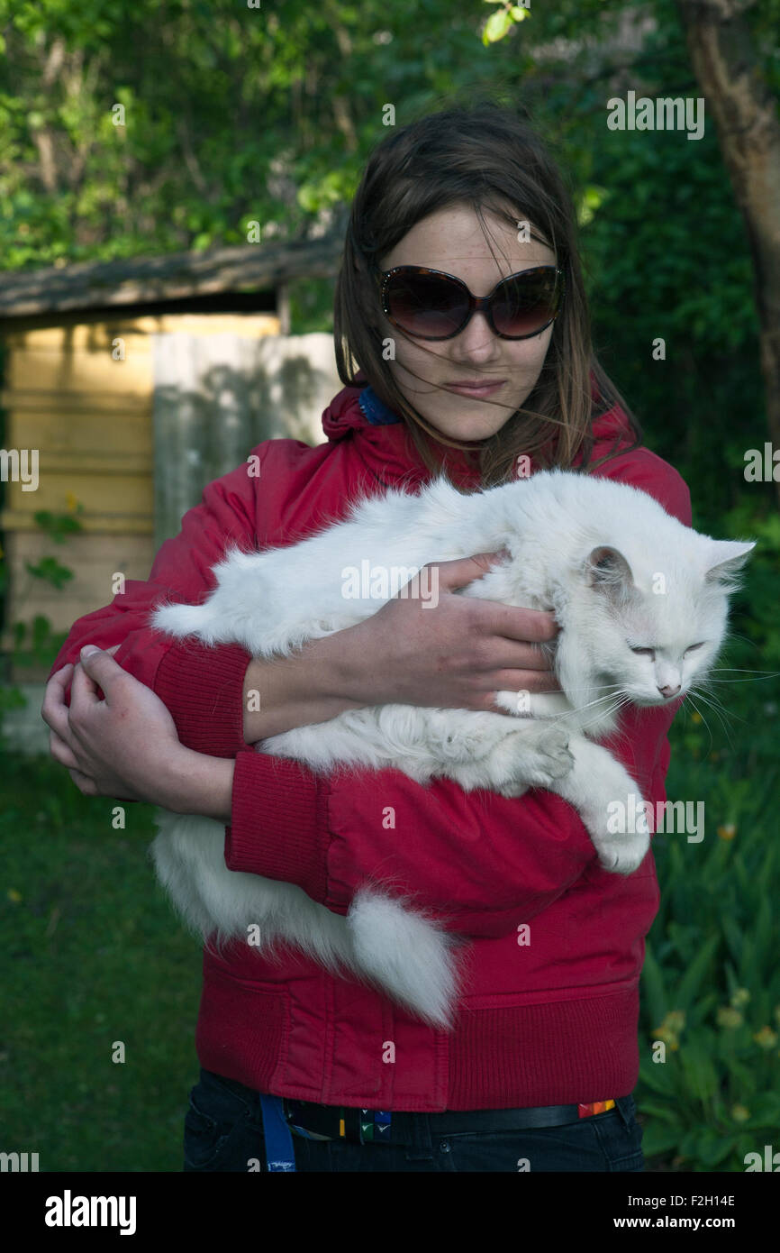 Girl holding a cat Stock Photo