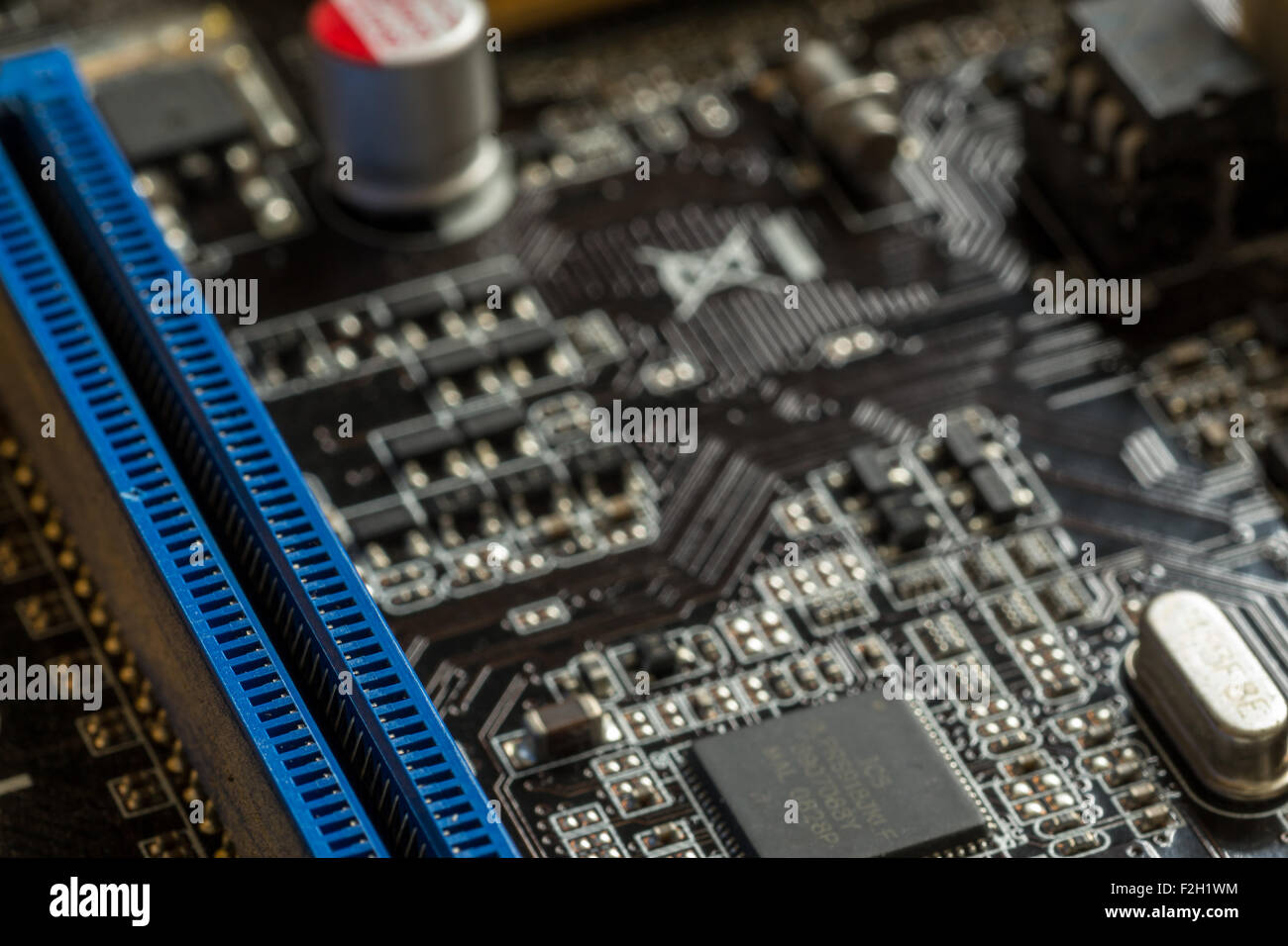 Macro Image of a Computer Motherboard with an empty RAM Slot Stock Photo