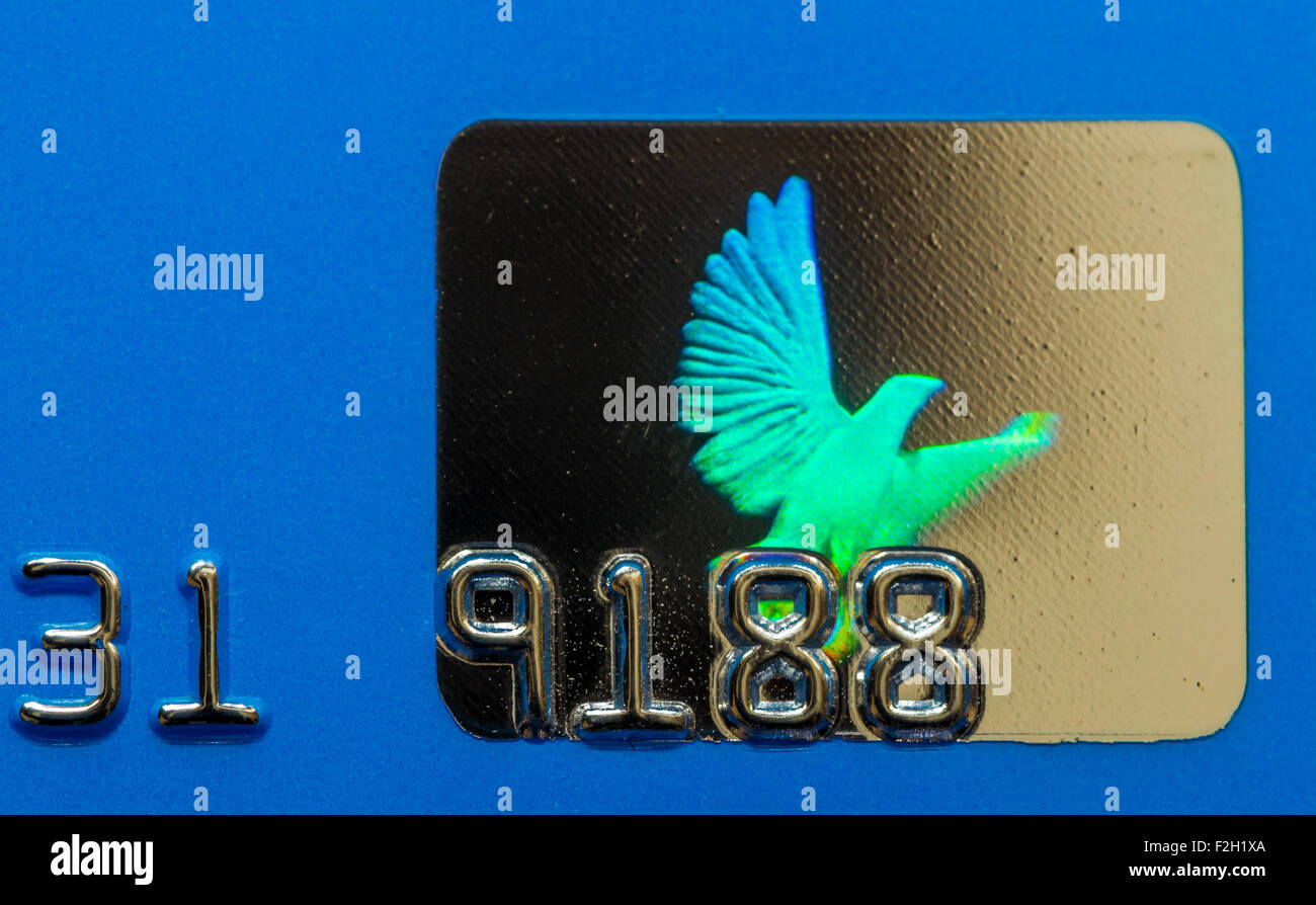 Closeup Macro photo of a flying dove hologram used on credit cards to