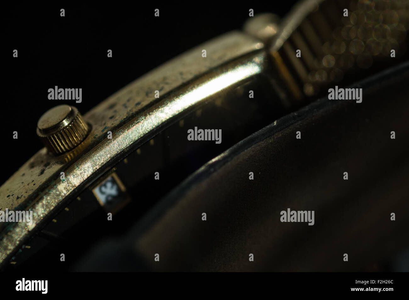 Macro closeup of an old gold watch strap with date calendar Stock Photo