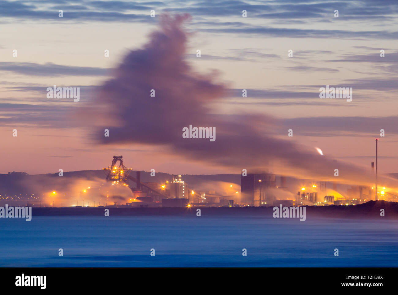 Seaton Carew, UK. 19th September, 2015. View of Redcar Steelworks at sunrise from Seaton Carew. Redcar Steelworks owners, SSI, announced yesterday that they were suspending steel production at the Redcar Plant due to mounting debts and fallling Steel prices. Around 2,000 people are employed at the plant.Seaton Carew, UK. 19th September, 2015. Credit:  Alan Dawson News/Alamy Live News Stock Photo