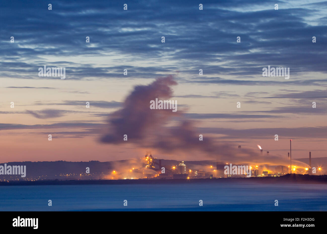 Seaton Carew, UK. 19th September, 2015. View of Redcar Steelworks at sunrise from Seaton Carew. Redcar Steelworks owners, SSI, announced yesterday that they were suspending steel production at the Redcar Plant due to mounting debts and fallling Steel prices. Around 2,000 people are employed at the plant.Seaton Carew, UK. 19th September, 2015. Credit:  Alan Dawson News/Alamy Live News Stock Photo