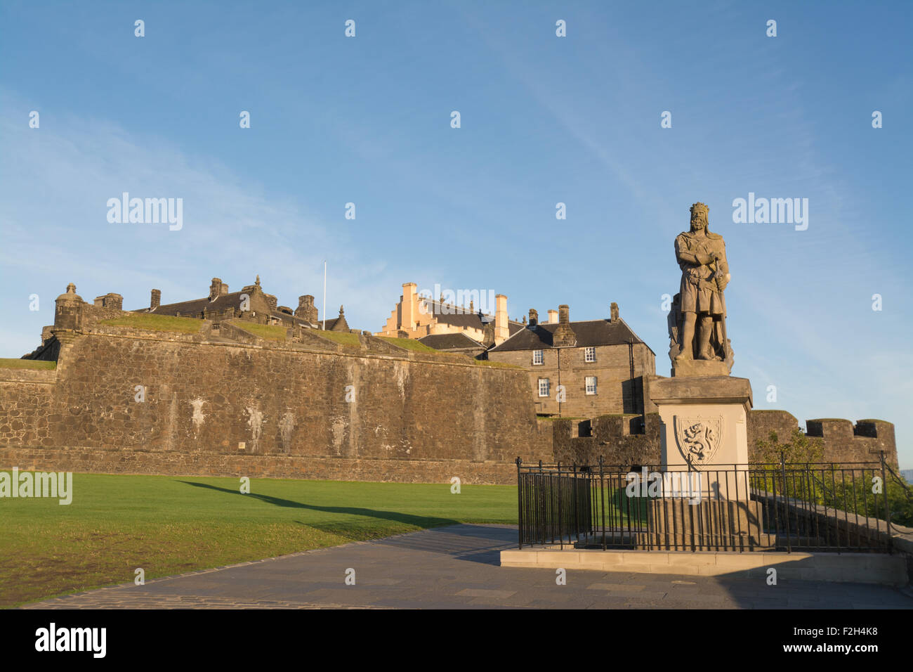 Robert the Bruce statue standing outside Stirling Castle, Scotland in early morning sun Stock Photo