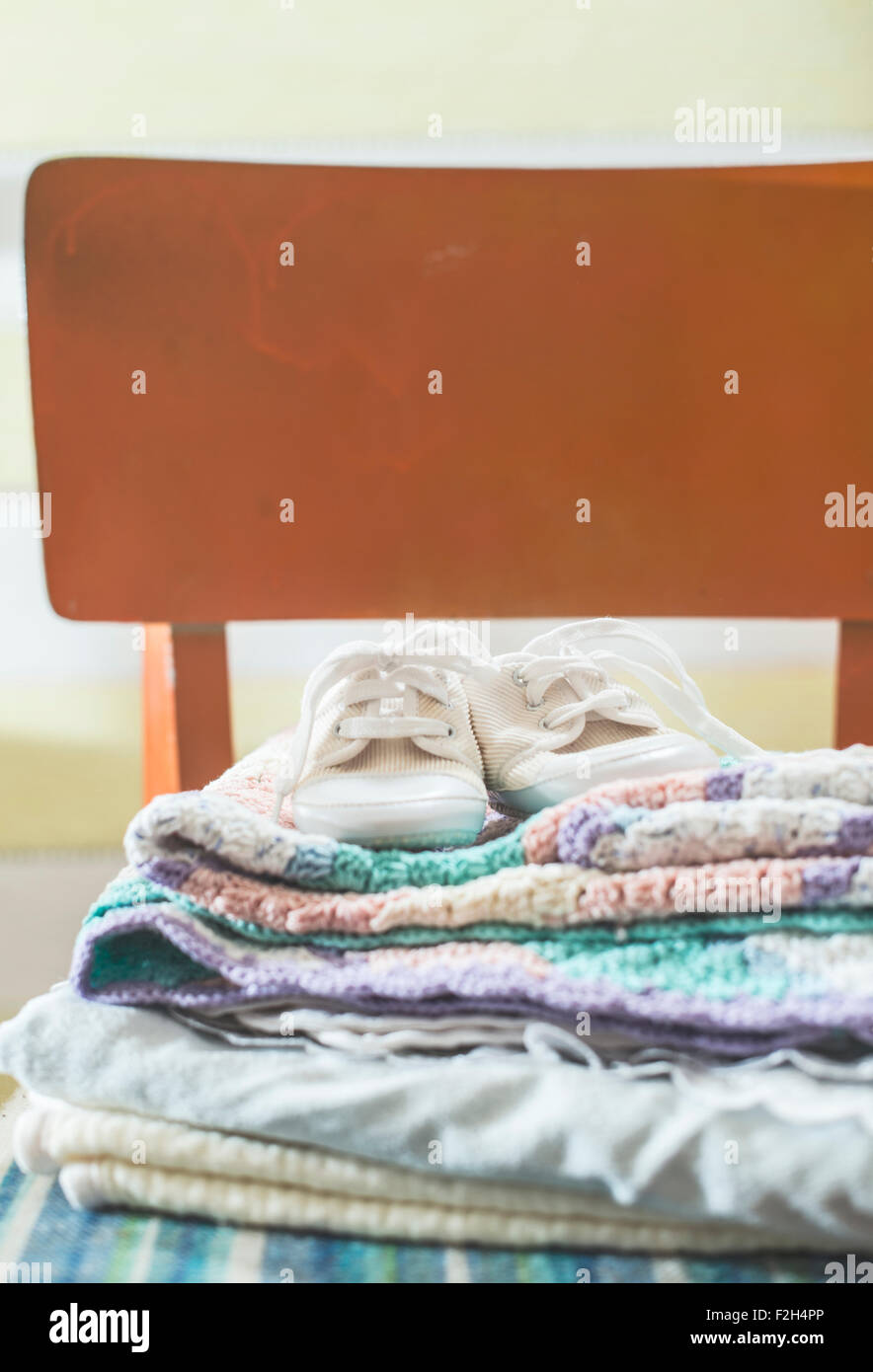 Baby blankets and shoes. Vintage style Stock Photo Alamy