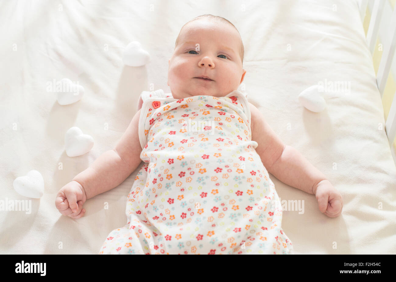 Newborn baby girl sleeping in bed hi-res stock photography and images ...
