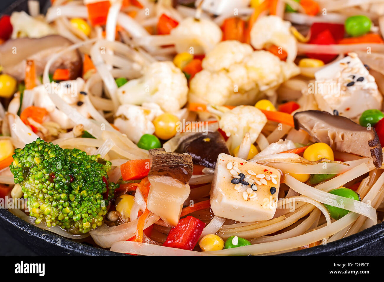 Rice noodles with vegetables tofu cheese and shiitake mushroom Stock