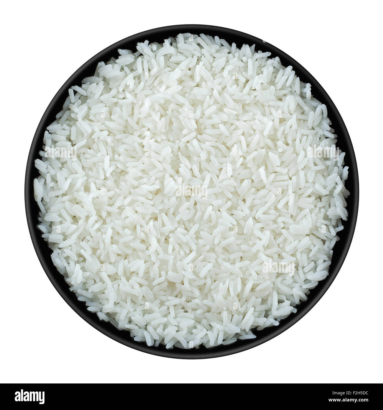 Rice in black plate isolated on white Stock Photo Alamy