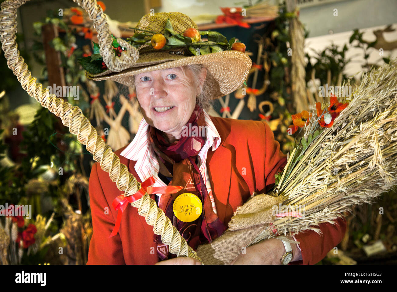 Straw hats & straw plaiters, a rural craft demonstration at Harrogate,  Yorkshire, UK. 18th Sept, 2015. Straw Plaiter Margaret Wildig, from  Tadcaster at the Harrogate Annual Autumn Flower Show. Straw plaiting is