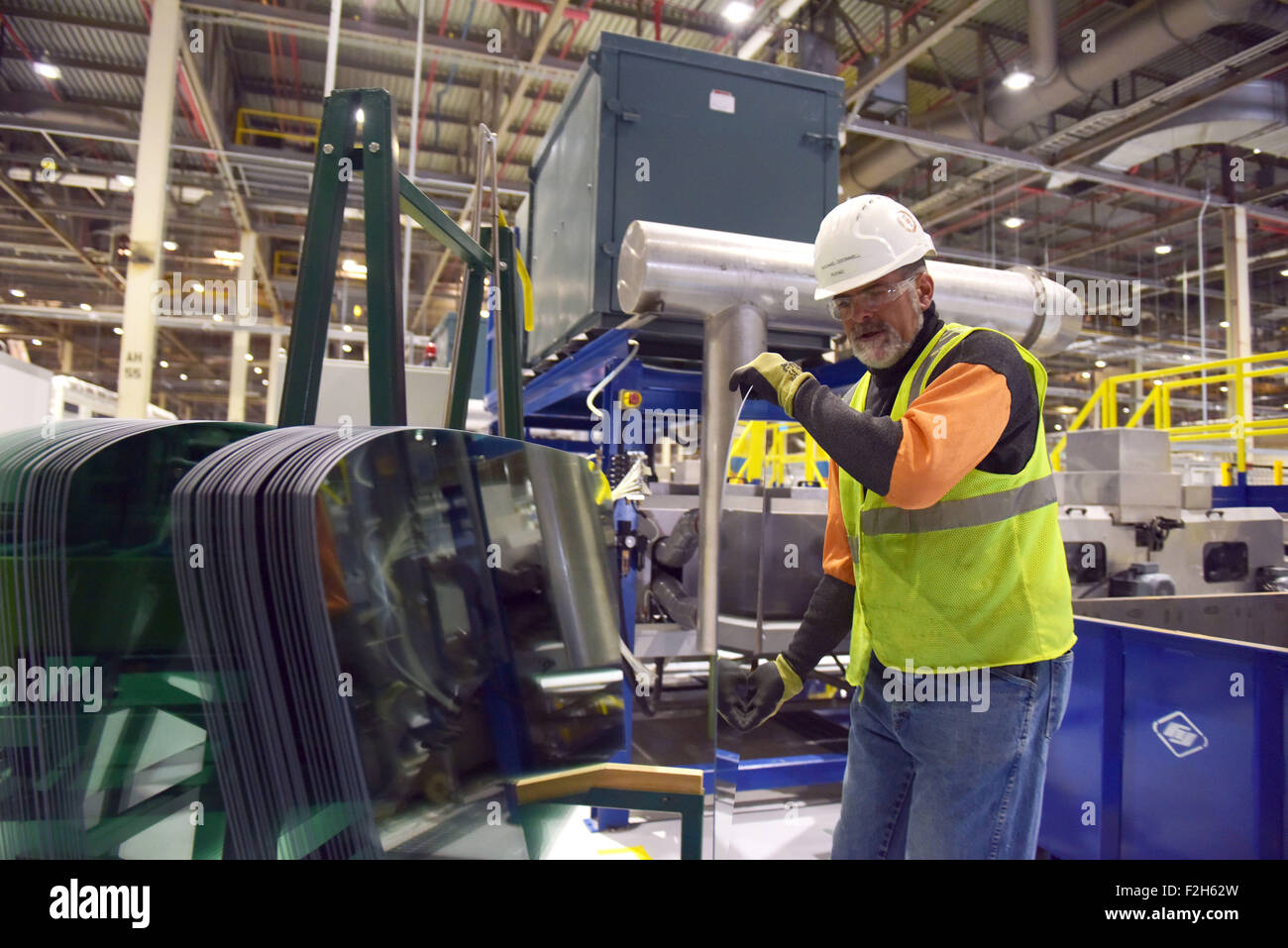 Moraine, USA. 5th Aug, 2015. Michael o'donnell works at a factory of Fuyao Glass America in Moraine, south of Dayton, Ohio, the United States, Aug. 5, 2015. Fuyao Glass Industry Group, the largest automotive glass supplier in China, invested over 360 million U.S. dollars to build an automobile glass factory in Moraine, Ohio, and will create over 1,500 jobs locally. © Yin Bogu/Xinhua/Alamy Live News Stock Photo