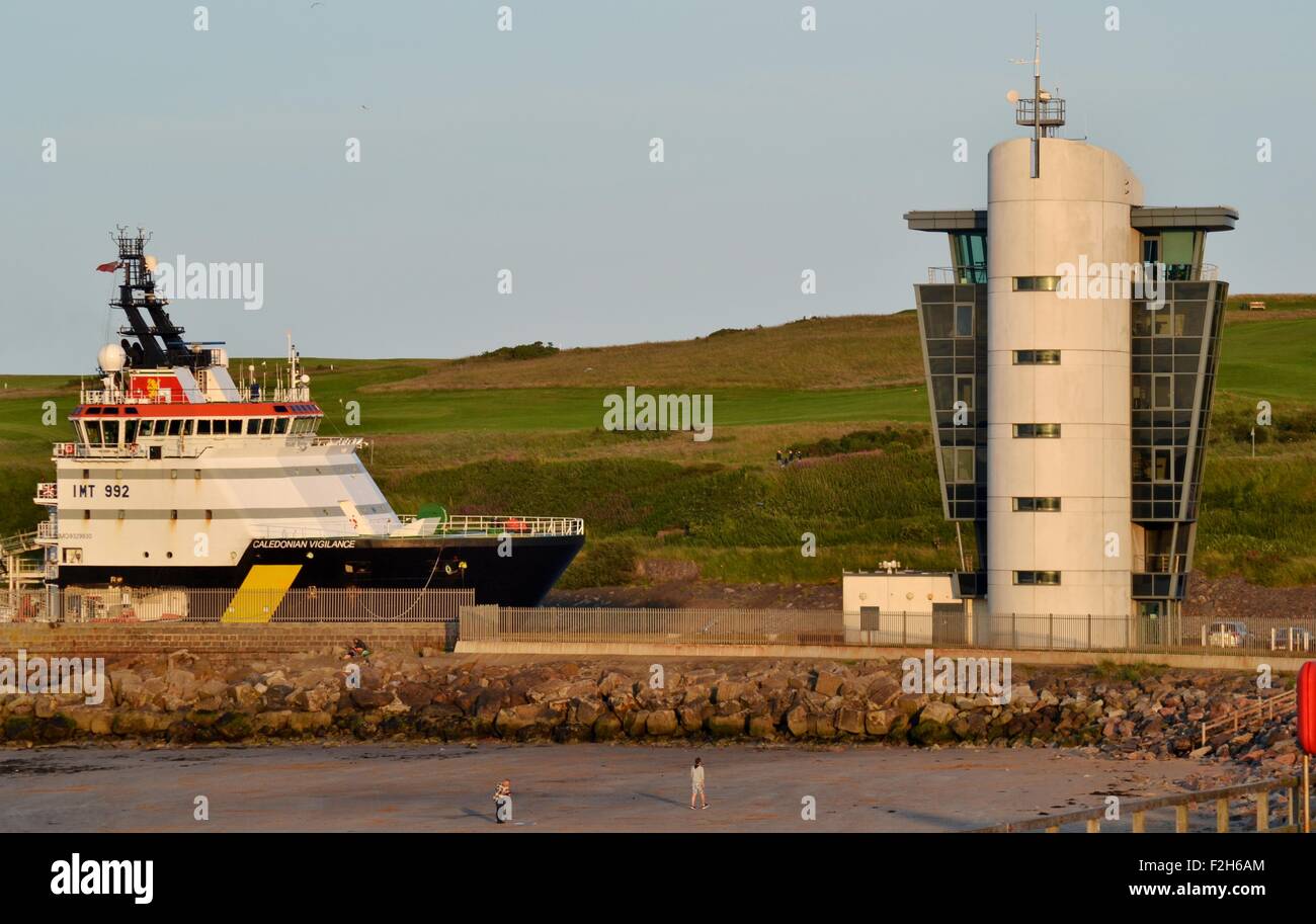 Boat arriving into Aberdeen harbour, Scotland Stock Photo