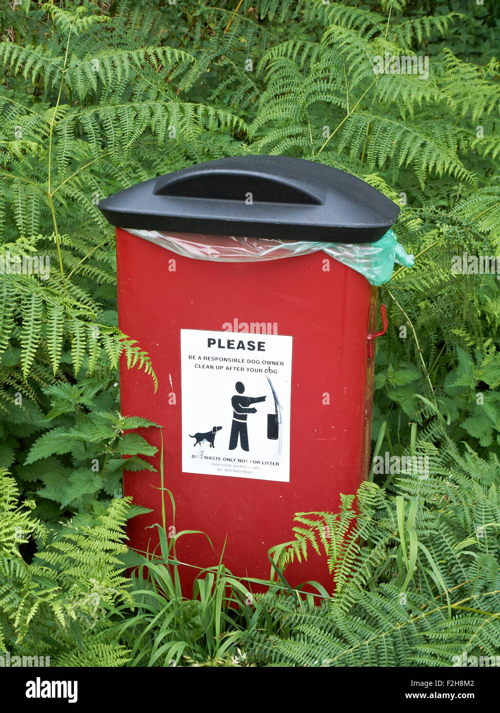Dog waste bin in countryside UK Stock Photo Alamy
