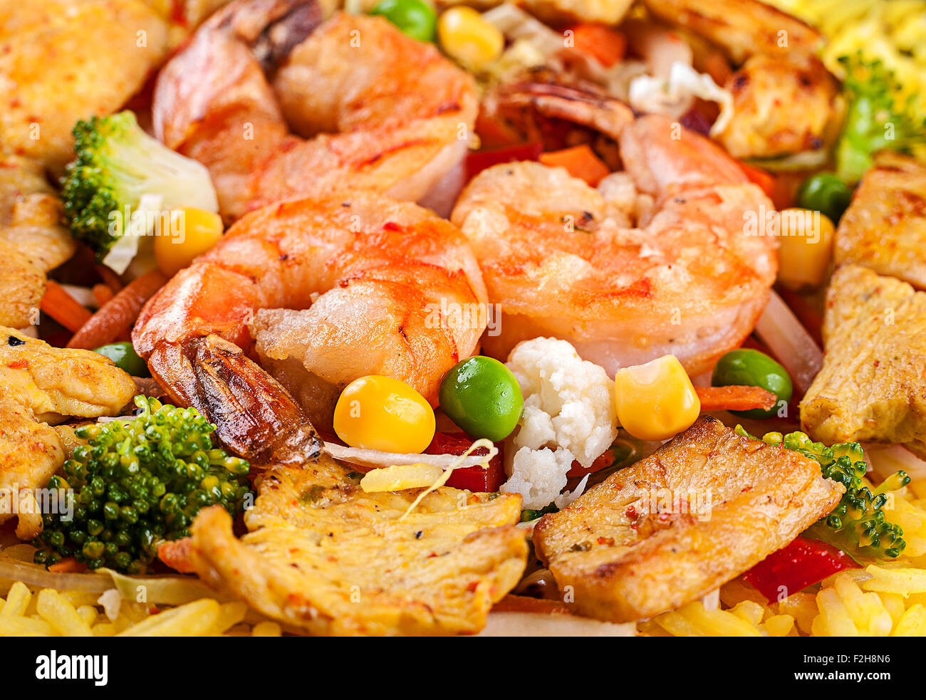 Yellow rice with tiger shrimp and vegetable Stock Photo
