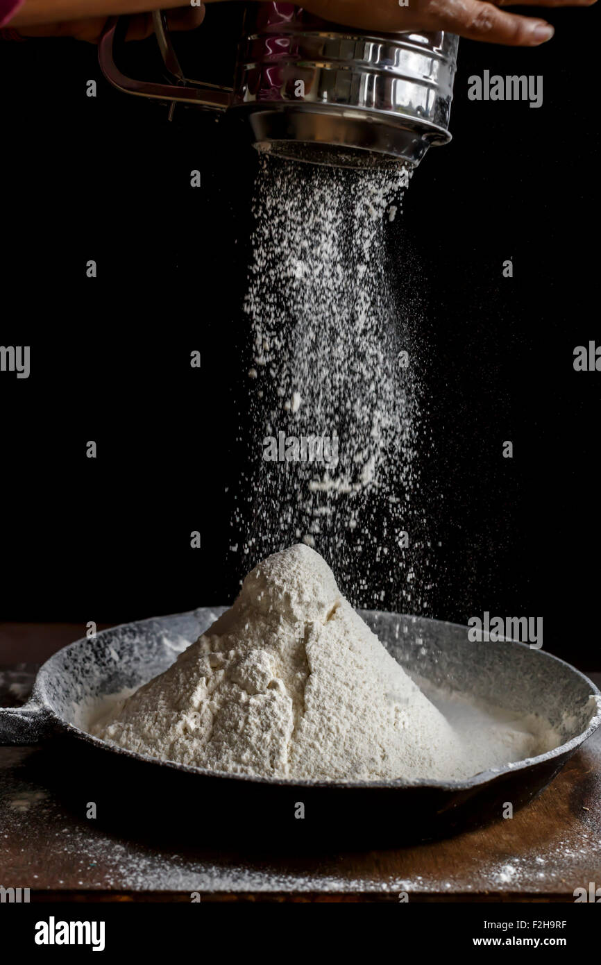 Sifting Flour, Ready for baking Stock Photo Alamy