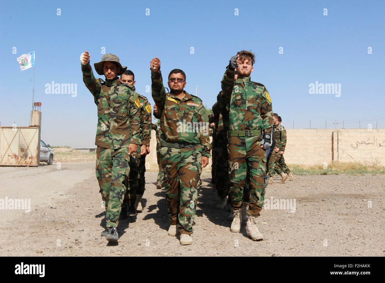 Kirkuk, Northern Iraq. 19th Sep, 2015. Fighters from Hashid Shaabi forces from paramilitary groups are reviewed at the end of their training period to fight Islamic State (IS) militants in the Kirkuk, Northern Iraq, Sept. 19, 2015. © Ako Zanagn/Xinhua/Alamy Live News Stock Photo