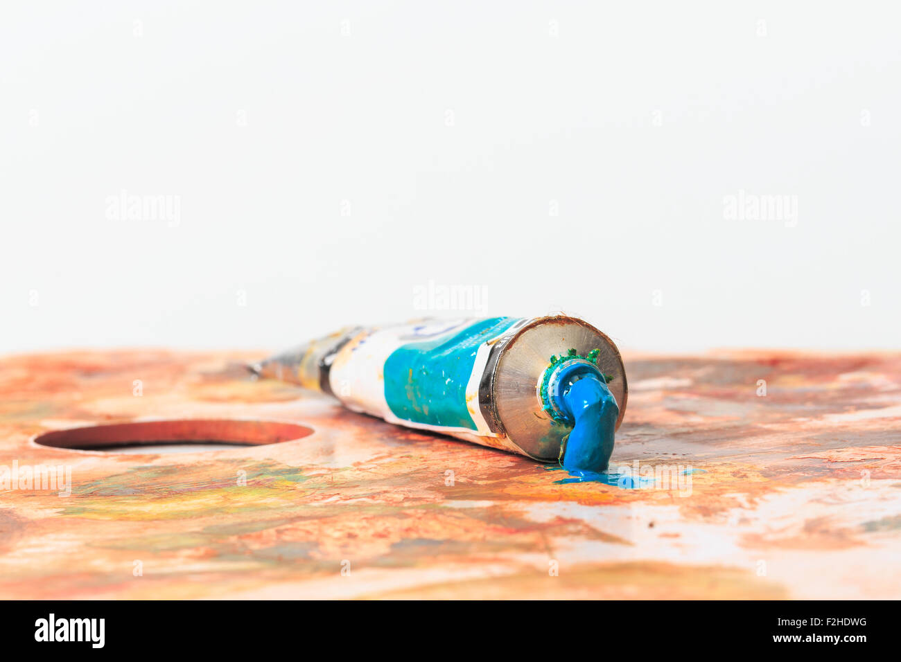 Blue open paint tube with squeezed paint Stock Photo Alamy