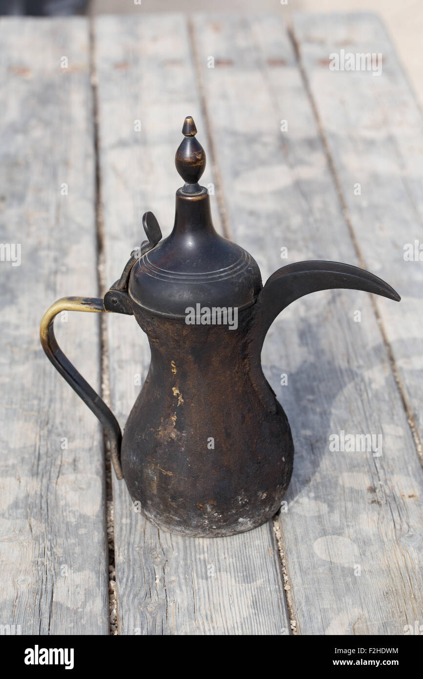https://c8.alamy.com/comp/F2HDWM/traditional-vintage-arabian-old-smoked-coffee-maker-in-bedouins-camp-F2HDWM.jpg