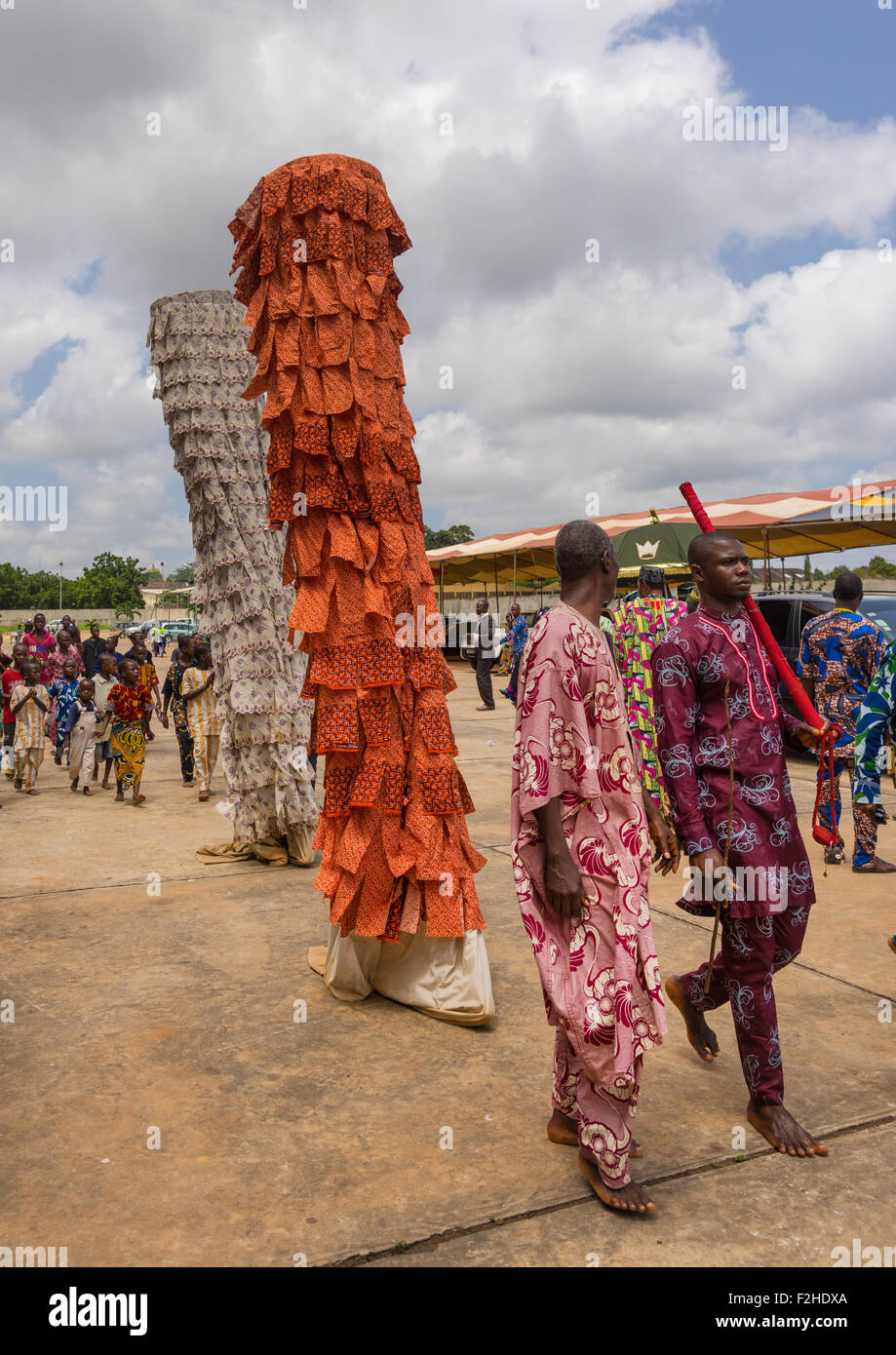 Benin, West Africa, Porto-Novo, men guiding a zangbeto guardian of the night spirit Stock Photo