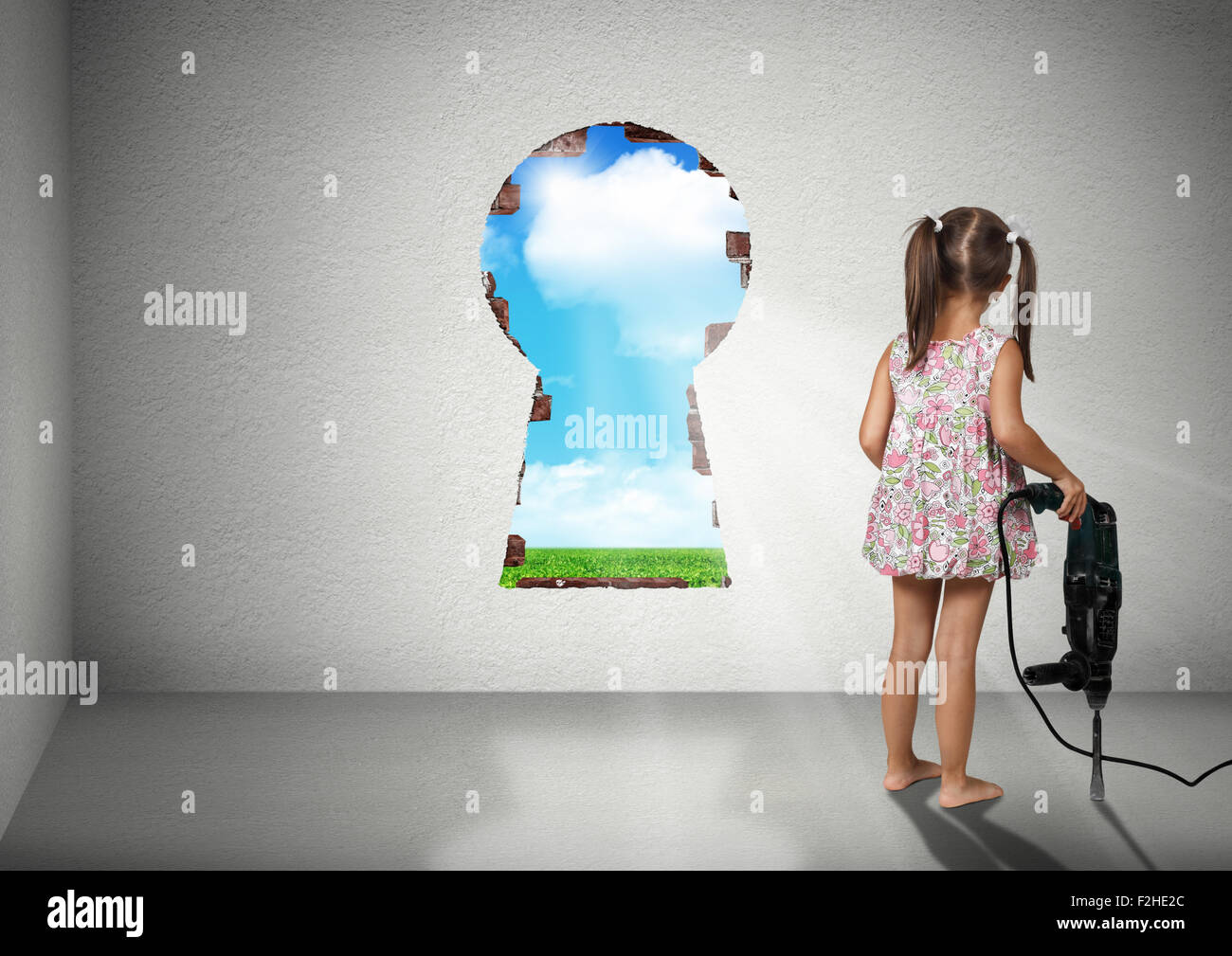 Child girl break wall, cognition creative concept Stock Photo