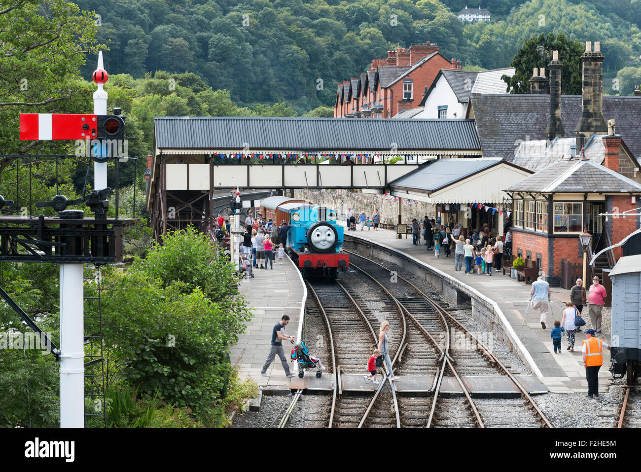 Steam train Thomas the tank engine at Llangollen railway station during a special event day with people on the platform, UK Stock Photo