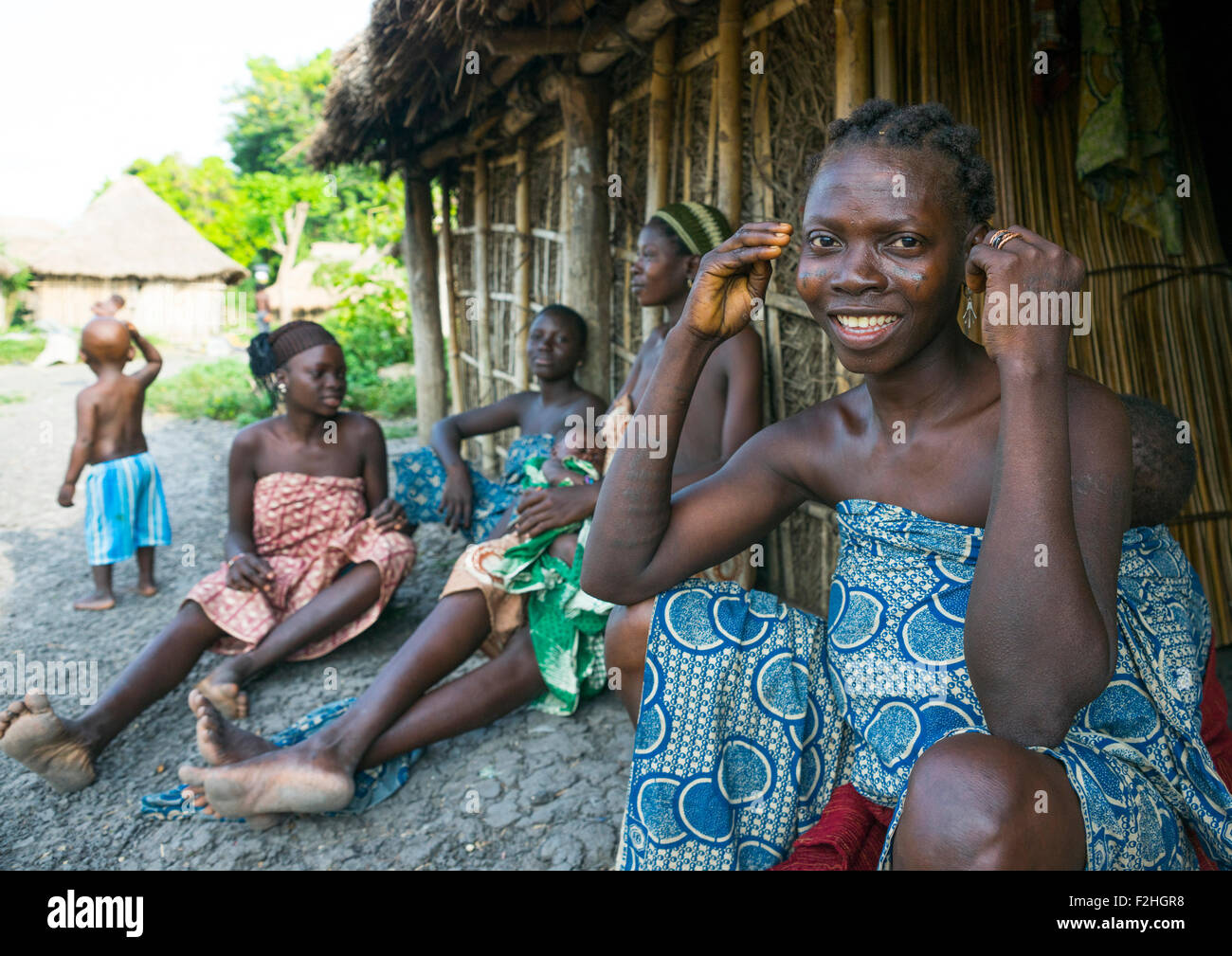 Benin, West Africa, Onigbolo Isaba, holi tribe women and children in front of their hut Stock Photo