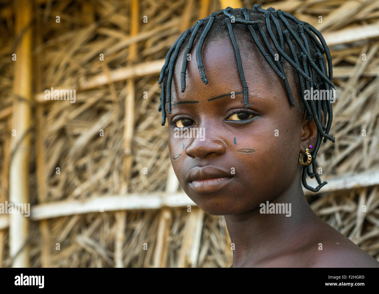 Benin, West Africa, Onigbolo Isaba, holi tribe girl with traditional facial tattoos and scars Stock Photo