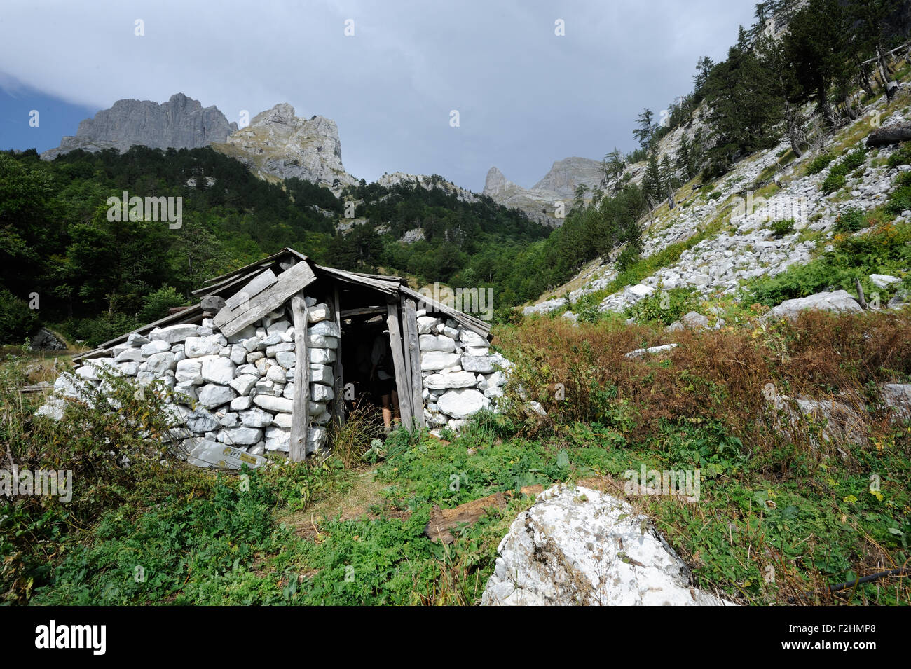 A deserted shepherd's stone hut  on the limestone slopes of the Blessed Mountains Bjeshket e Bekura  Valbona, Albania. Stock Photo