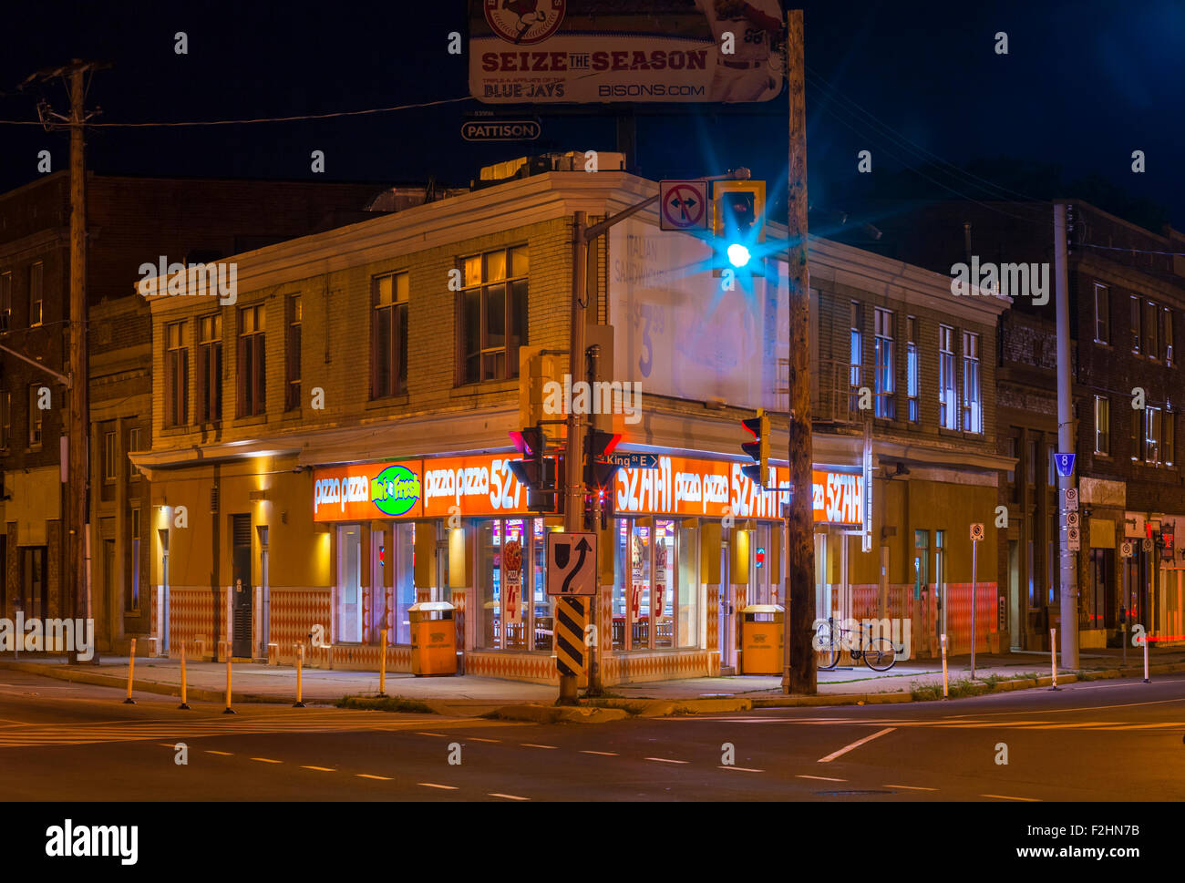 A Pizza Pizza fast food restaurant at night, located where Main St East