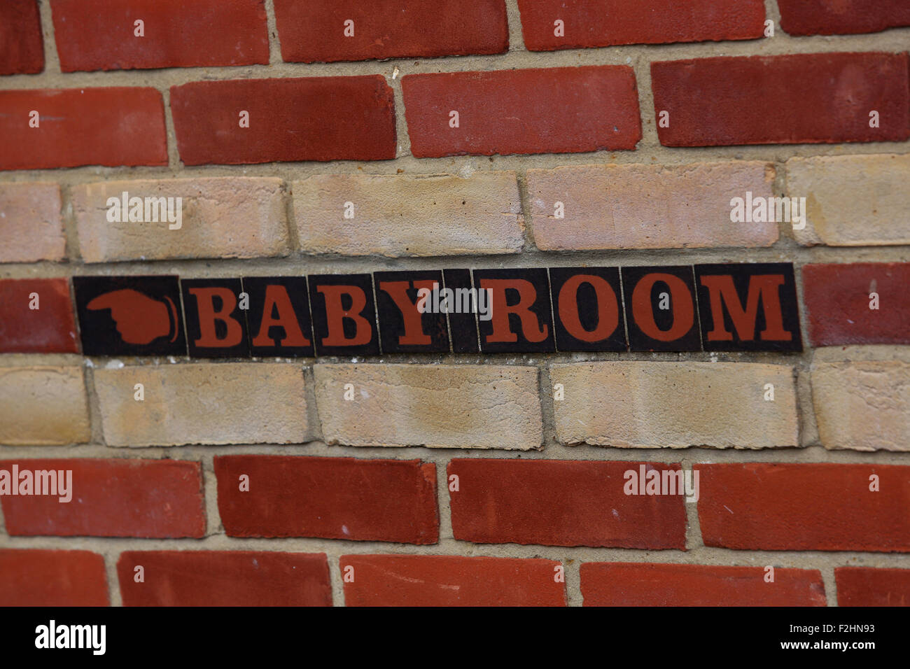 Baby Room sign outside a public toilet block in Beaulieu in the New Forest, Hampshire, UK. Stock Photo