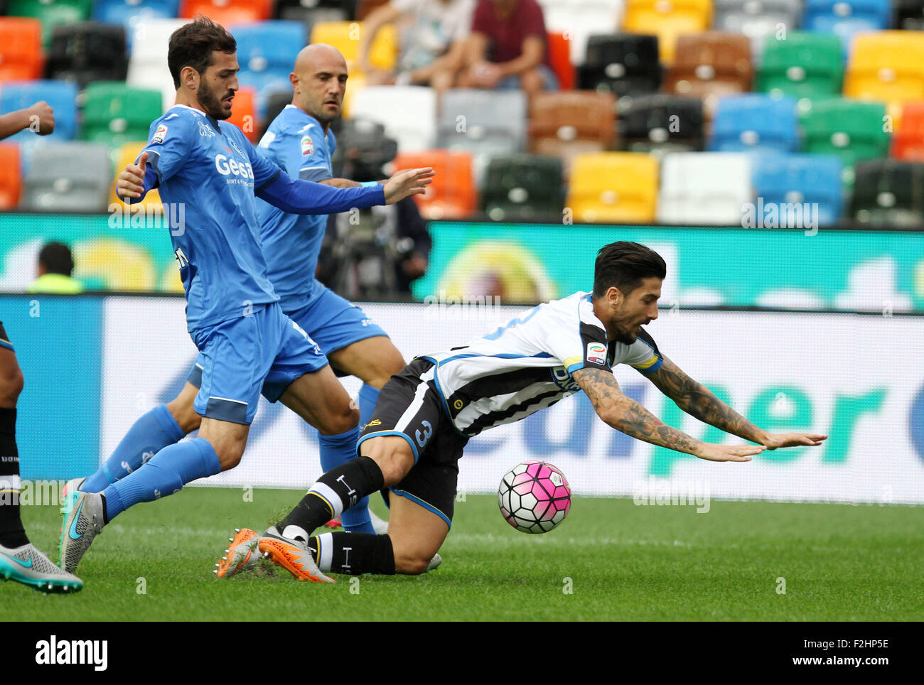 Udine, Italy. 19th September, 2015. Udinese's midfielder Panagiotis Giorgios Kone (R) fouls during the Italian Serie A football match between Udinese Calcio v Empoli at Friuli Stadium on 19 September, 2015 in Udine. Credit:  Andrea Spinelli/Alamy Live News Stock Photo