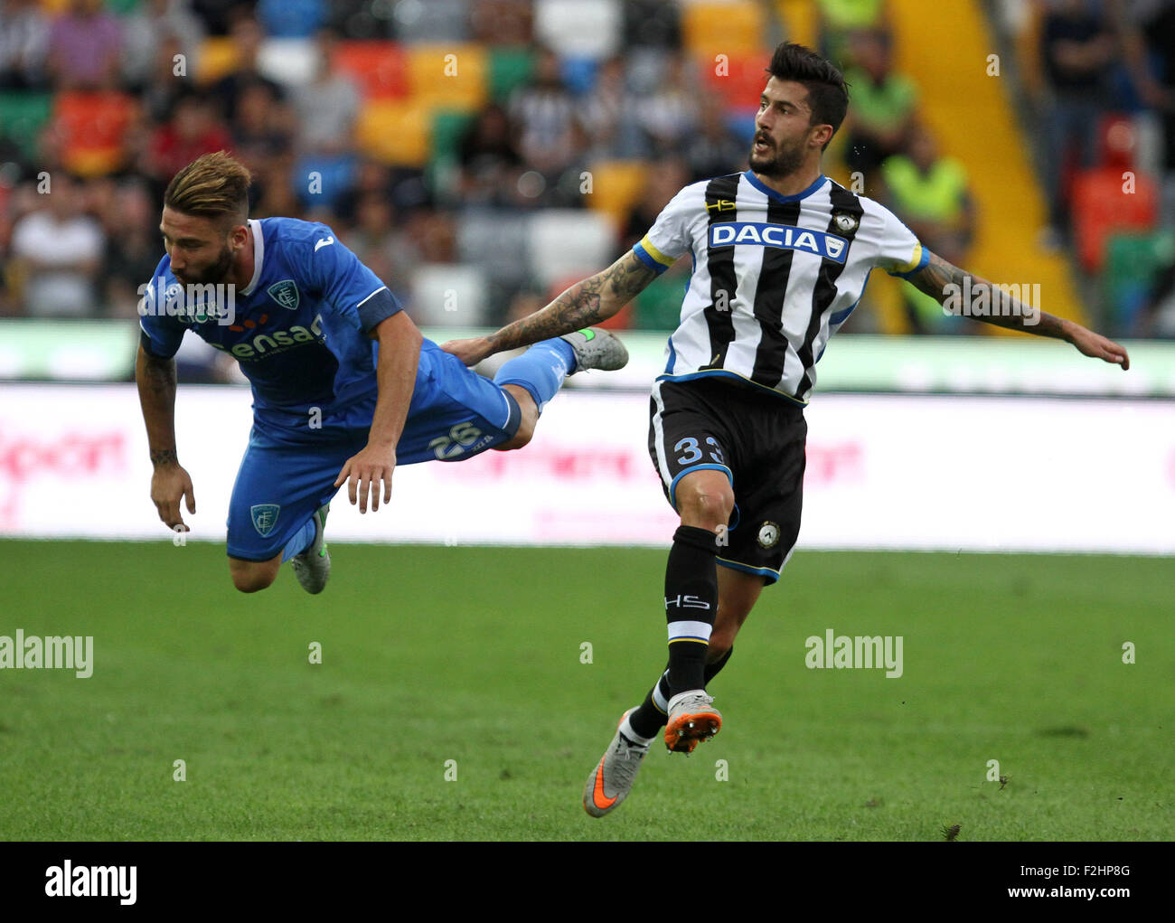 Udine, Italy. 19th September, 2015. Udinese's midfielder Panagiotis Giorgios Kone (R) fights for the ball with Empoli's defender Lorenzo Tonelli during the Italian Serie A football match between Udinese Calcio v Empoli at Friuli Stadium on 19 September, 2015 in Udine. Credit:  Andrea Spinelli/Alamy Live News Stock Photo