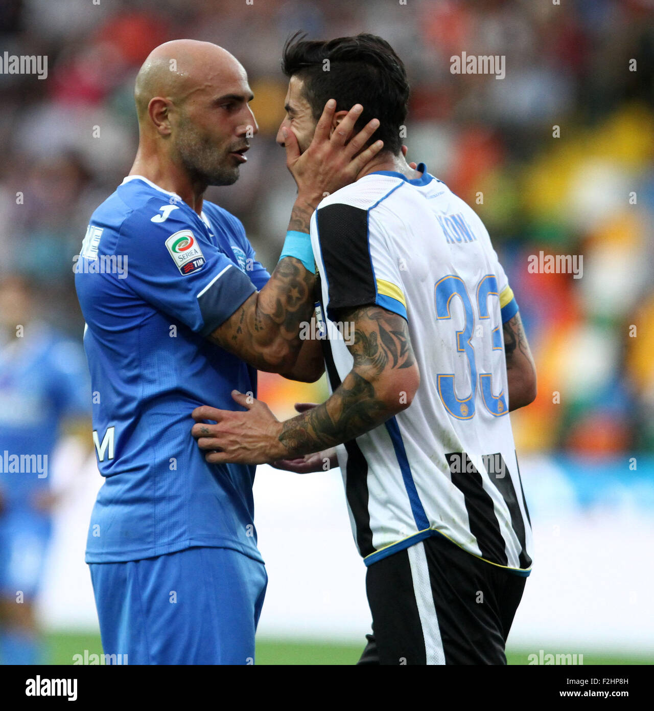 Udine, Italy. 19th September, 2015. Empoli's forward Massimo Maccarone reacts with Udinese's midfielder Panagiotis Kone during the Italian Serie A football match between Udinese Calcio v Empoli at Friuli Stadium on 19 September, 2015 in Udine. Credit:  Andrea Spinelli/Alamy Live News Stock Photo