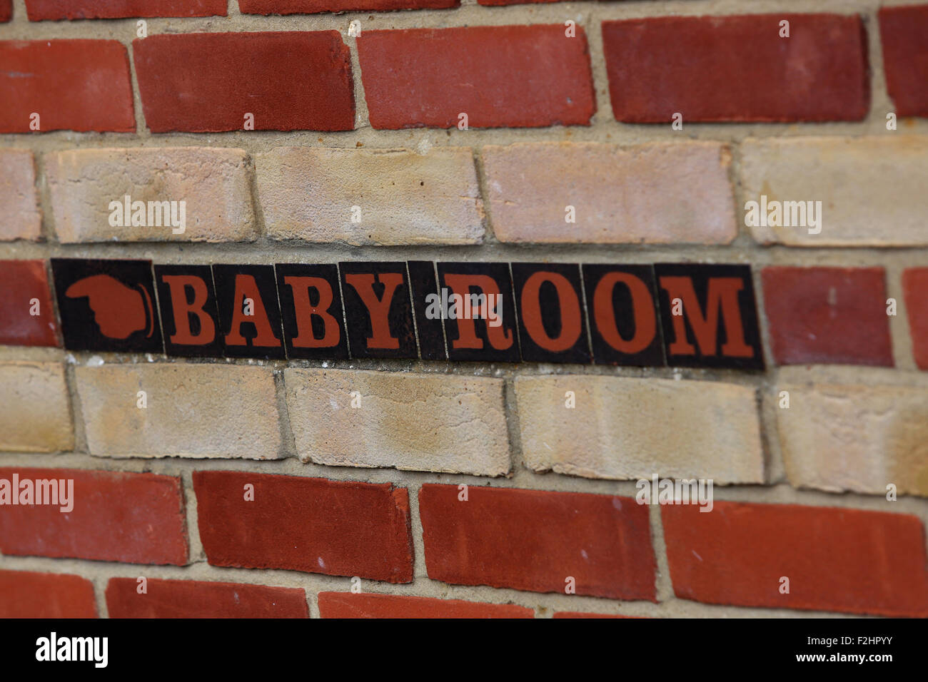 Baby Room sign outside a public toilet block in Beaulieu in the New Forest, Hampshire, UK. Stock Photo