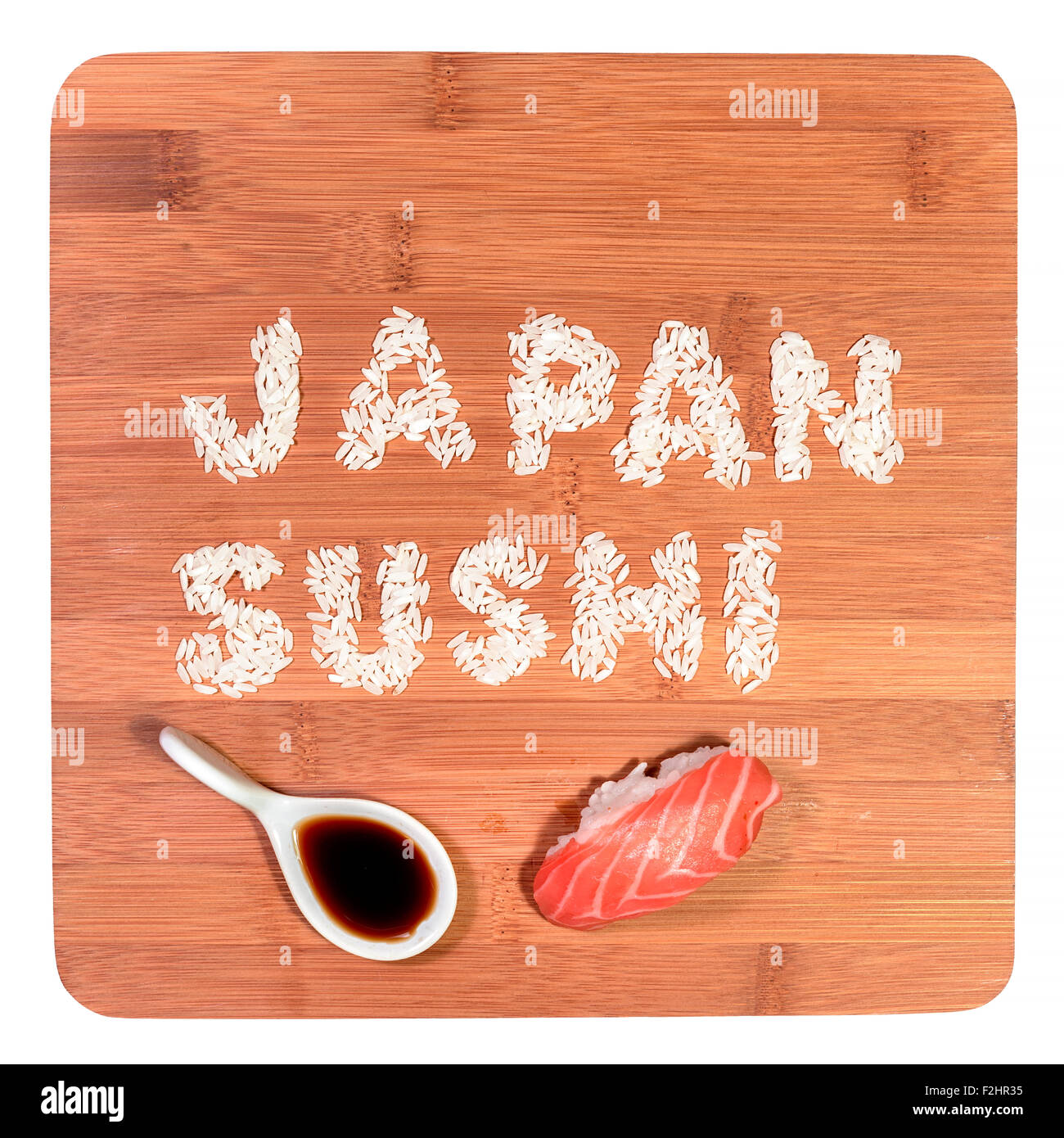 japan sushi written rice with sushi pieces and soy sauce on bamboo