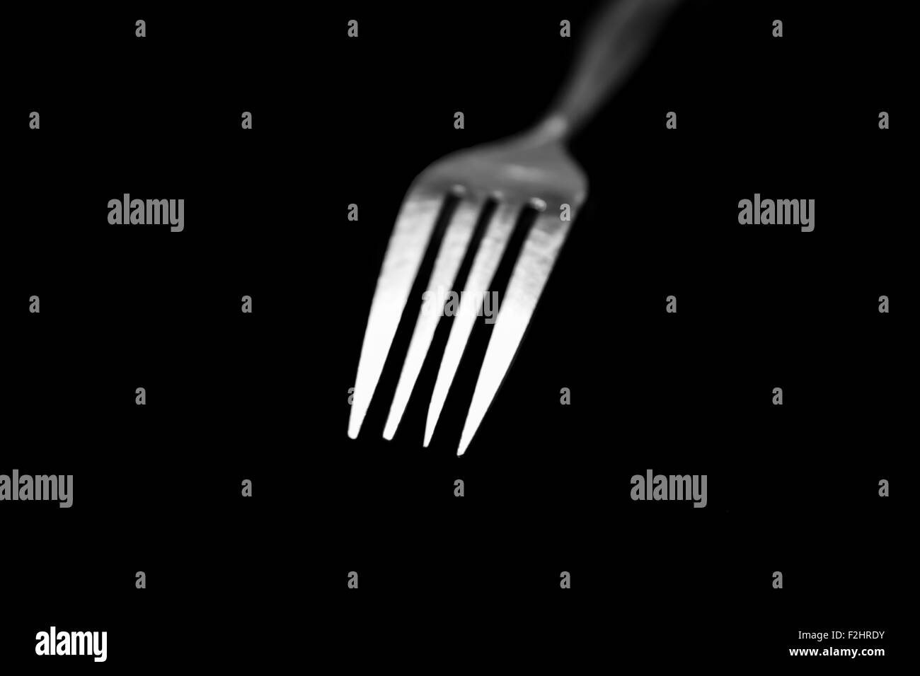fork isolated on a black background Stock Photo