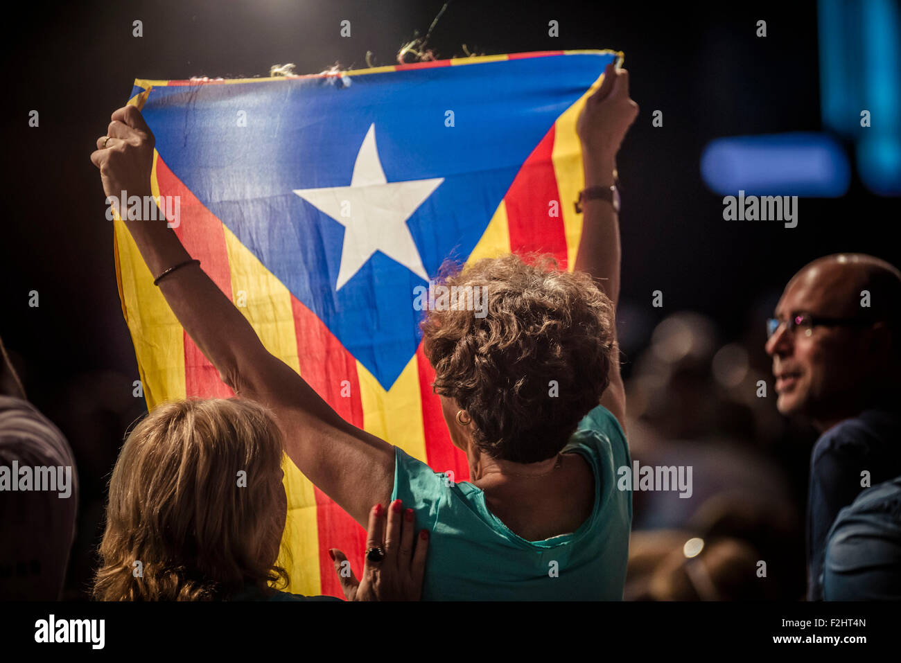 L'Hospitalet, Spain. September 19th, 2015: A supporter holds an 'estelada flag' during the central campaign act of the pro-independence cross-party electoral list 'Junts pel Si' (Together for the yes) in L'Hospitalet de Llobregat Credit:  matthi/Alamy Live News Stock Photo