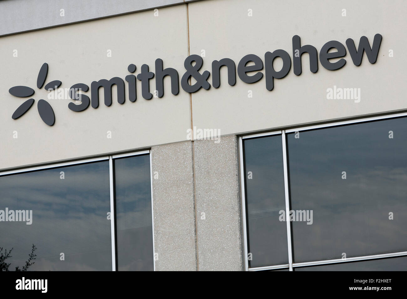 A logo sign outside of a facility occupied by Smith & Nephew in Austin